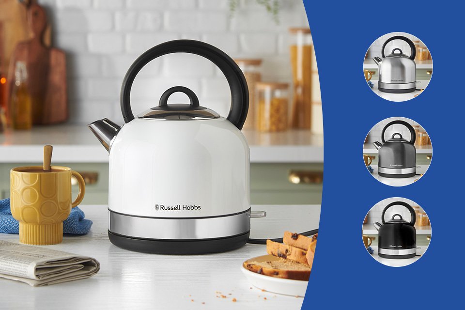A white Russell Hobbs Worcester dome kettle on a kitchen countertop with other things.
